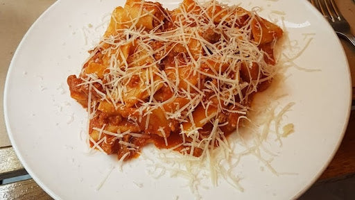 Pappardelle Al Ragu’ Di Salsiccia Con Olio Tartufato